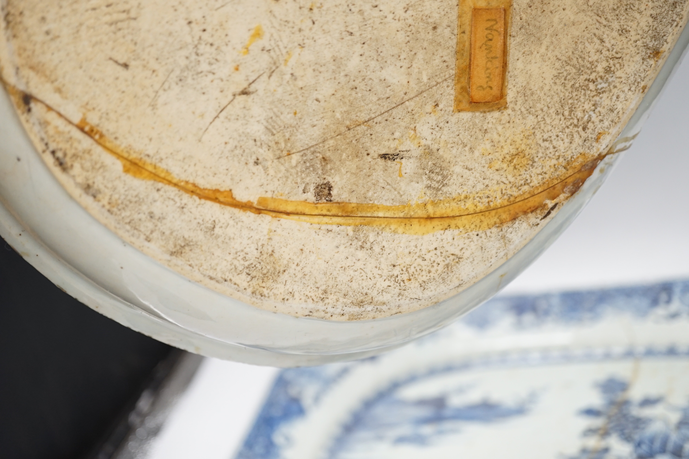 Three 18th century Chinese blue and white export dishes, largest 46x39cm